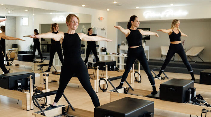 group reformer class on balanced body studio reformers